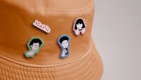 a hat with four pins on it