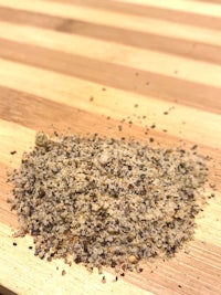 a pile of seasoning on a wooden cutting board
