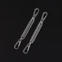 a pair of metal chain links on a black background