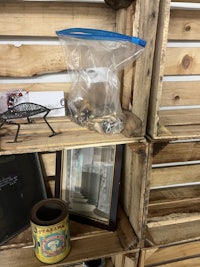 a wooden crate with various items on it