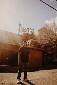a man standing in front of a building