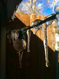 icicles hanging from a fence