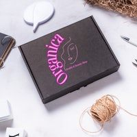 a black box with the words organica on it