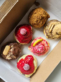 a box with a variety of donuts in it