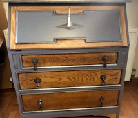 a desk with drawers and a knob on it