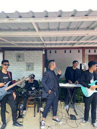a group of people playing music on a stage