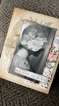an old photo of a woman with a hat on it