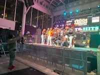 a group of people on stage at a concert