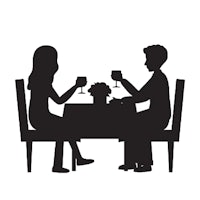 a silhouette of a man and woman at a table