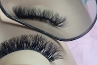 a pair of eyeglasses with fake lashes on them