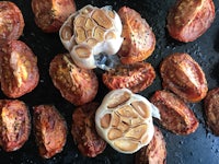 roasted tomatoes and garlic on a grill