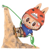a figurine of a rabbit climbing up a mountain