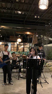 a group of people playing music in a restaurant
