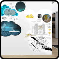 a room with a wall full of drawings and diagrams