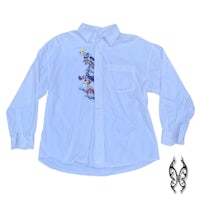 a white shirt with embroidered characters on it