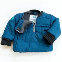 a blue jacket with a zipper on it