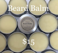 beard balm in tins with the words'beard balm'