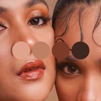 two women are posing for a photo