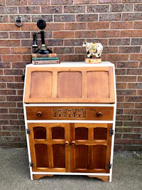 a wooden desk with a clock on it