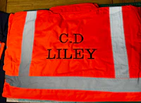 two orange safety vests with the words cd liley on them