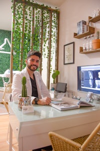 a man sitting at a desk in front of a computer