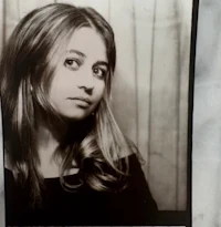 a black and white photo of a woman with long hair