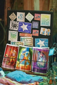 a display of t - shirts and stickers on a table