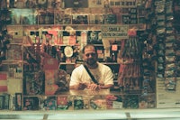 a man standing in front of a store