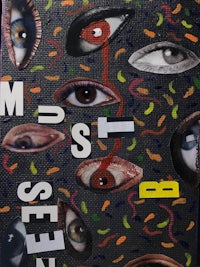 a piece of art with many eyes on it