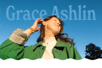 Grace, a young white woman, is smiling and looking up towards the sky with her eyes closed. She is wearing a cream turtleneck with a bright green jacket and her hair is down. The blue sky is behind her along with the words “Grace Ashlin”.