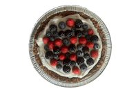 a pie with berries and cream on top