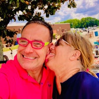 a woman wearing a pink shirt and a man wearing a blue shirt