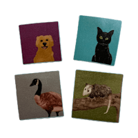 four coasters with a cat, a dog, and a goose