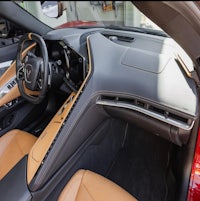 the interior of a tan and brown car