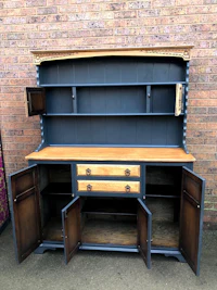 a blue and wood hutch with drawers