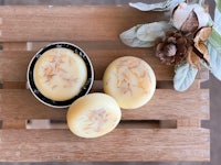 three soaps on top of a wooden crate