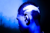 a man with a tattoo on his head