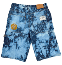 a pair of blue tie dye shorts with a yellow patch
