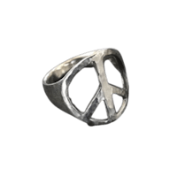 a silver peace sign ring on a black background