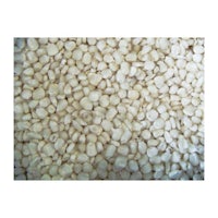 a pile of white peas on a white surface