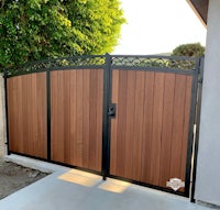 a wooden gate with a black and brown finish
