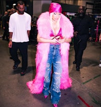 nicki minaj in a pink fur coat and jeans
