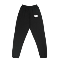 a black sweatpants with the word bad on them