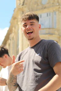 a man wearing a grey t-shirt