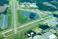 an aerial view of an airport with solar panels