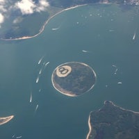 an aerial view of a small island in the water