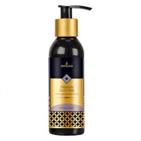 a bottle of black and gold body lotion