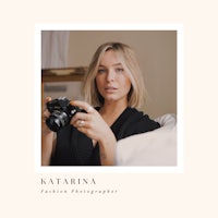 a woman holding a camera with the words katarina fashion photographer
