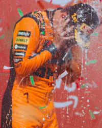 a nascar driver is covered in confetti