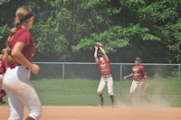 a group of softball players on a field